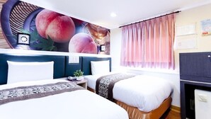 A hotel room with two beds, a large wall mural, a desk with a lamp, and a wardrobe. - The Dealer Hotel (Taipei)