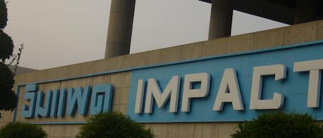 A building with a sign that reads "IMPACT".