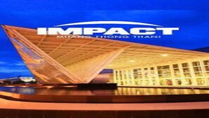 A modern building with a distinctive roof structure and a glass facade. - DMK Donmueang Airport Guesthouse (Pak Kret)