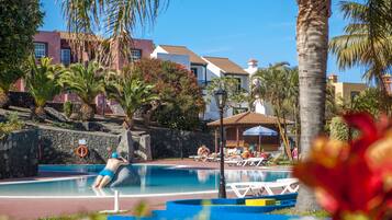 Outdoor pool, pool umbrellas, sun loungers