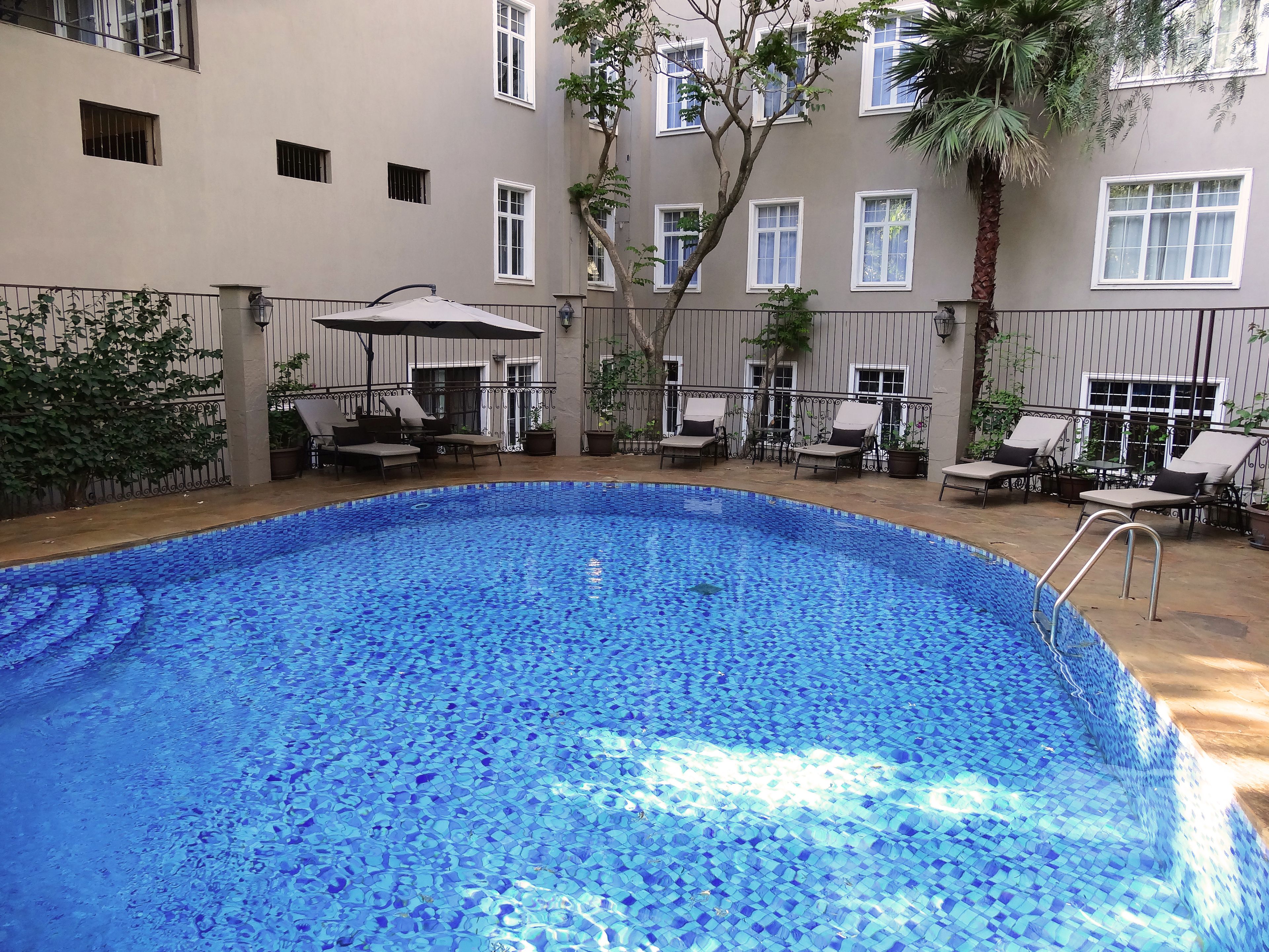 indoor pool, outdoor pool, pool umbrellas, pool loungers