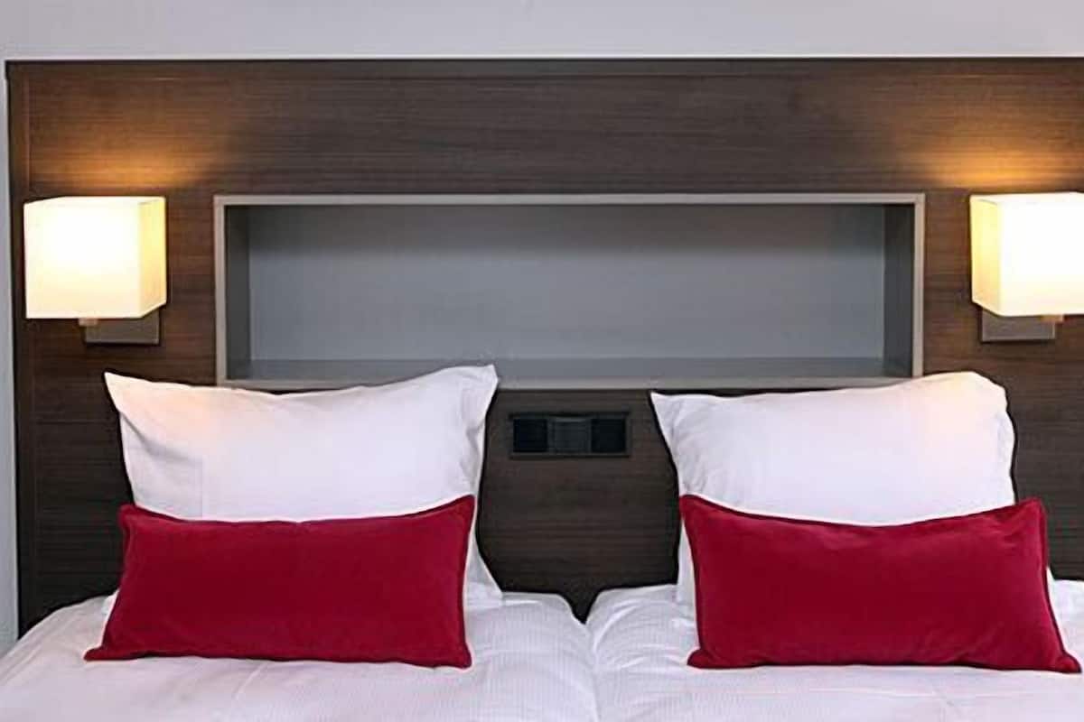 suite, 2 single beds, balcony | premium bedding, in-room safe, desk, cots/infant beds