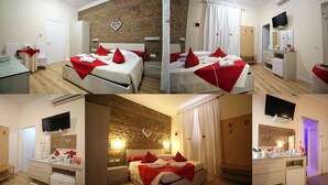 A hotel room with a stone wall, a bed with red and white bedding, a TV, a minibar, and a bathroom with a shower. - Freedom Love B&B (Rome)