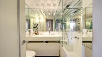 Designer toiletries, hair dryer, slippers, bidet