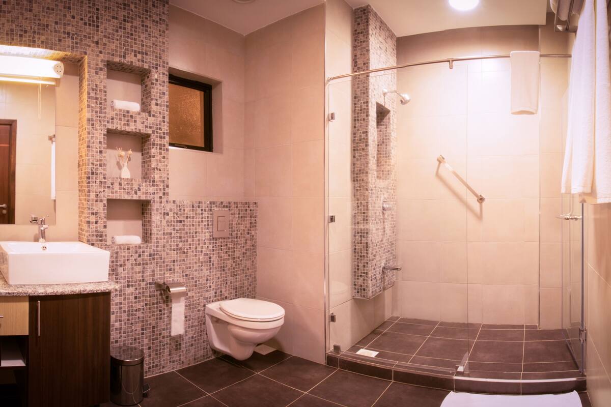 two bedroom executive suite | bathroom | shower, rainfall showerhead, free toiletries, hair dryer
