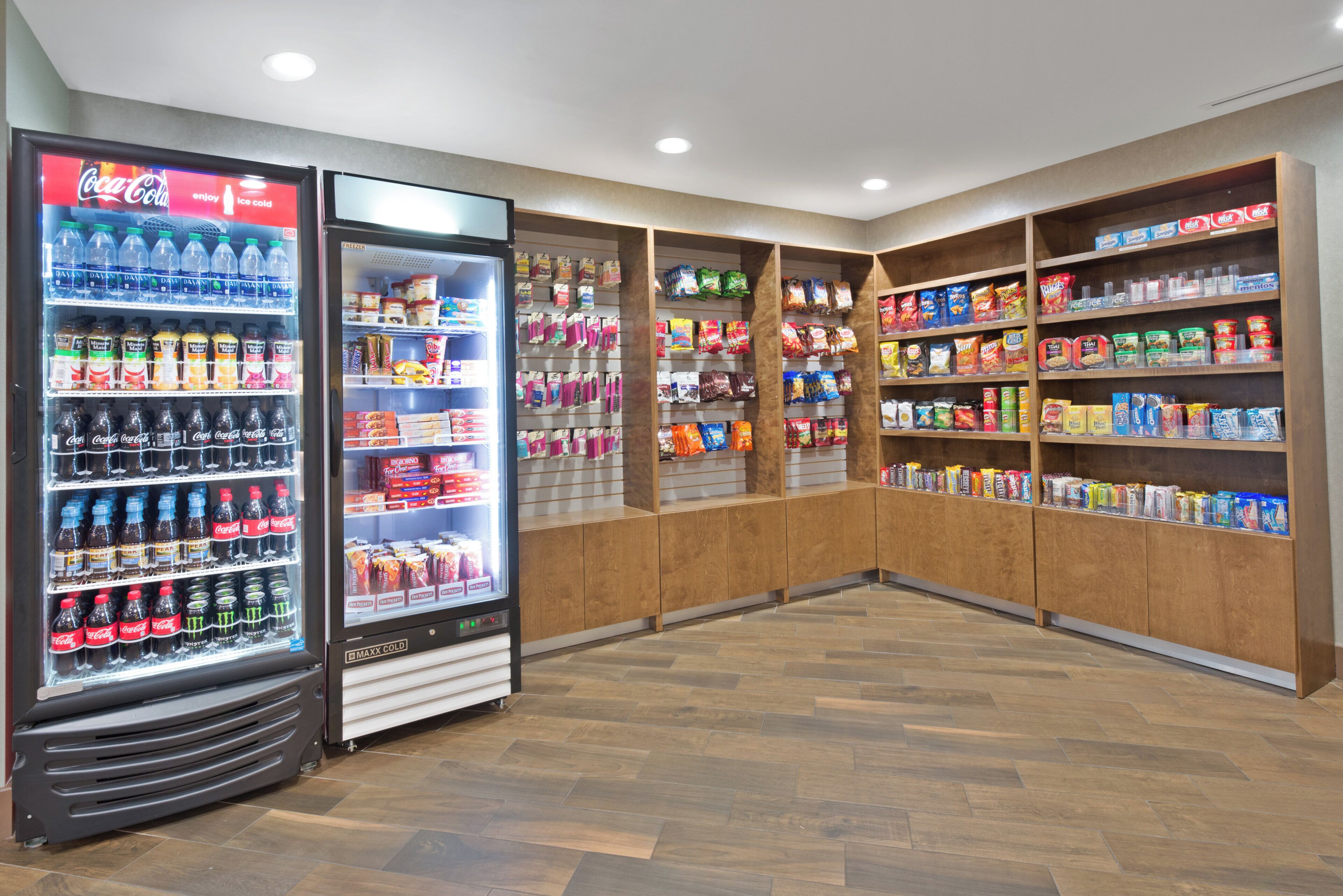 A snack and beverage vending area with various drinks and snacks.