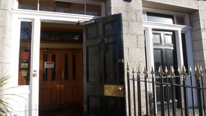 A building entrance with a sign reading "PARK" and a door with a brass handle. - Inn At The Park (Aberdeen)
