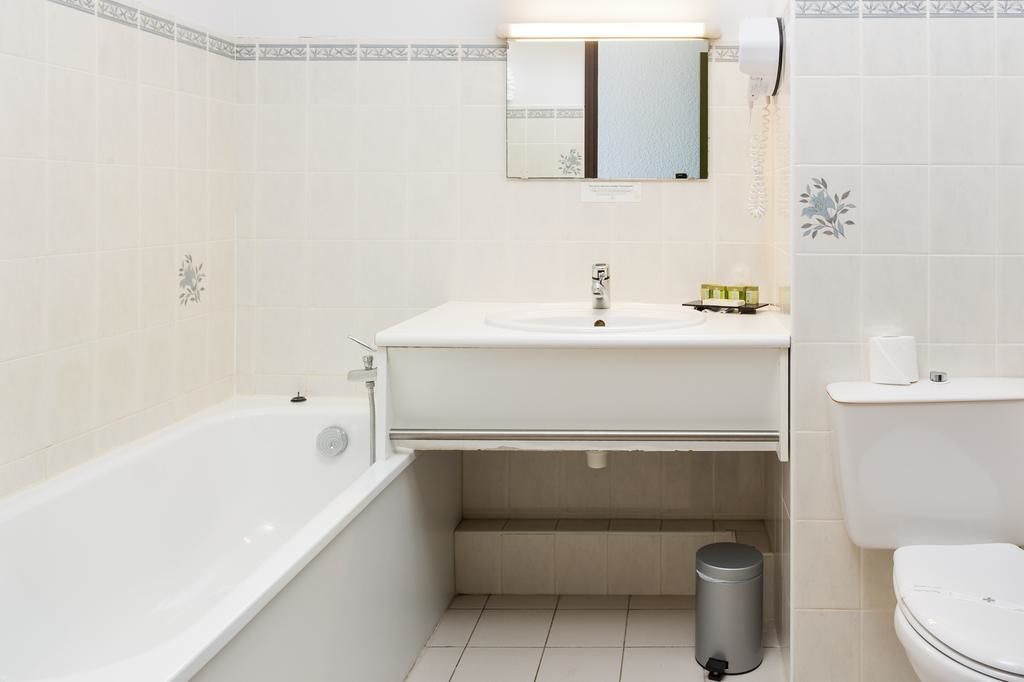 bathtub, free toiletries, hair dryer, towels