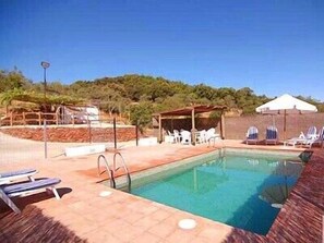 Seasonal outdoor pool, pool umbrellas, pool loungers