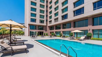 Outdoor pool, open 8:00 AM to 7:00 PM, pool loungers