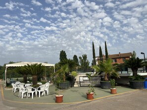 Seasonal outdoor pool, pool umbrellas, pool loungers