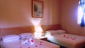 Standard Room, 2 Double Beds | Desk, iron/ironing board, bed sheets - Beau Rivage Hotel (Cap-Haitien)