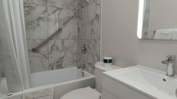Single Room, 1 Queen Bed | Bathroom | Combined shower/tub, deep soaking tub, hair dryer, towels