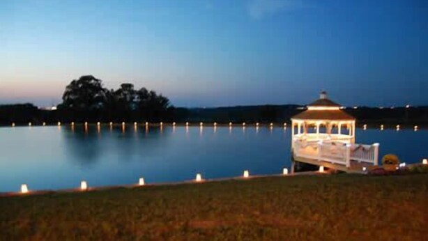 A gazebo by a calm lake at dusk. - Lefevre Inn and Resort (Galena)