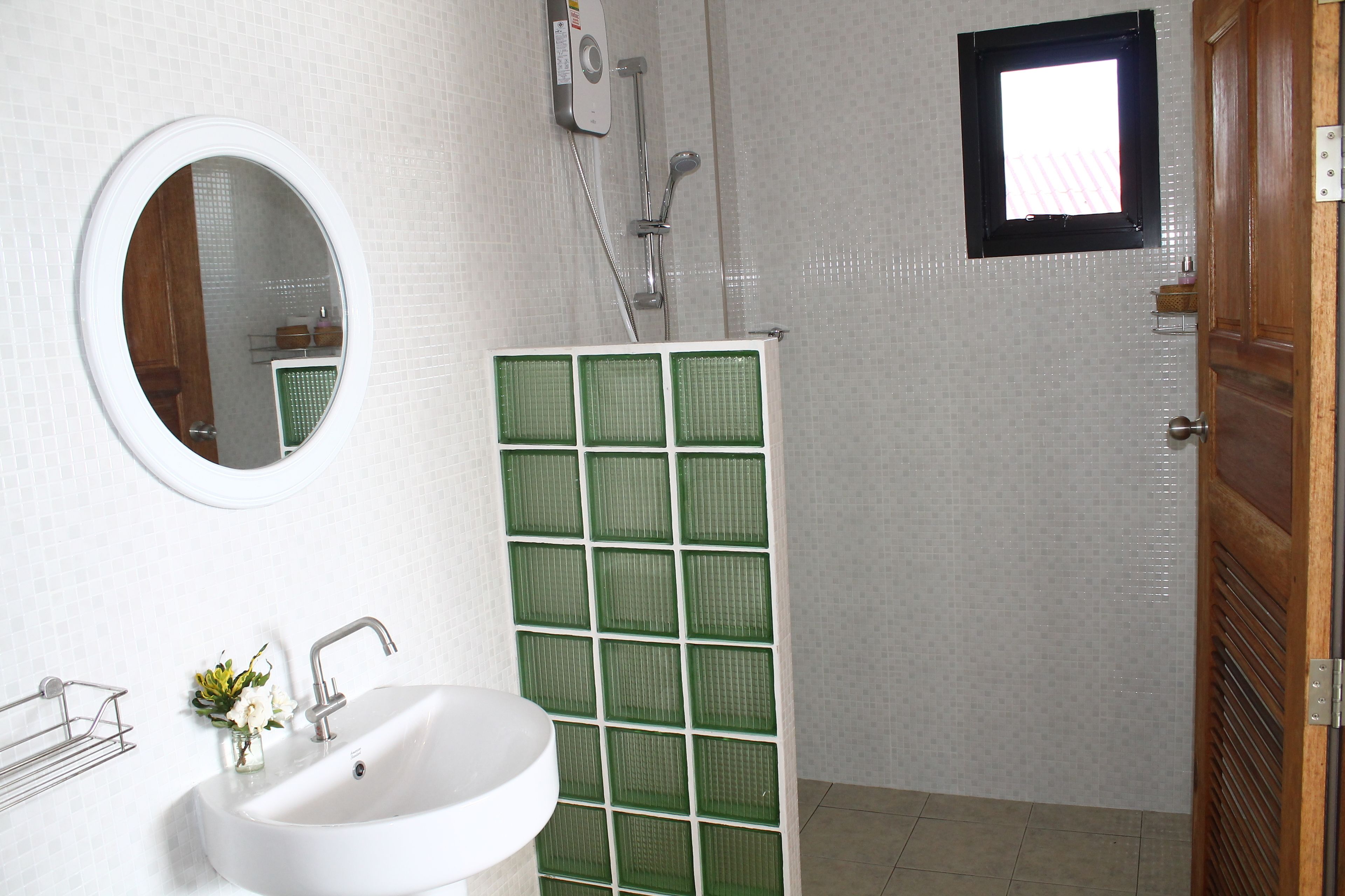 superior double bungalow (8) | bathroom | shower, free toiletries, hair dryer, slippers