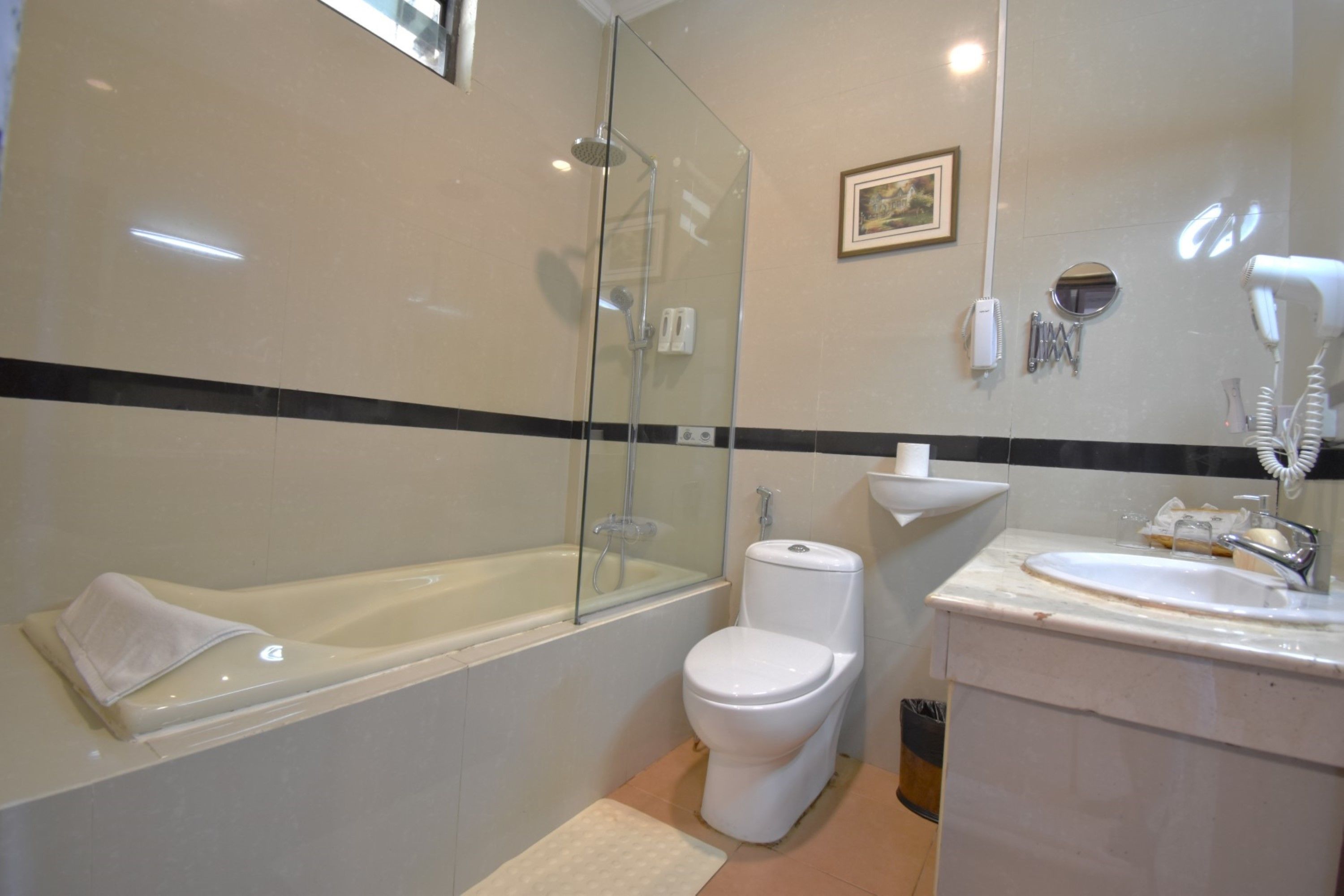 jacuzzi ocean suite | bathroom | free toiletries, hair dryer, slippers, bidet