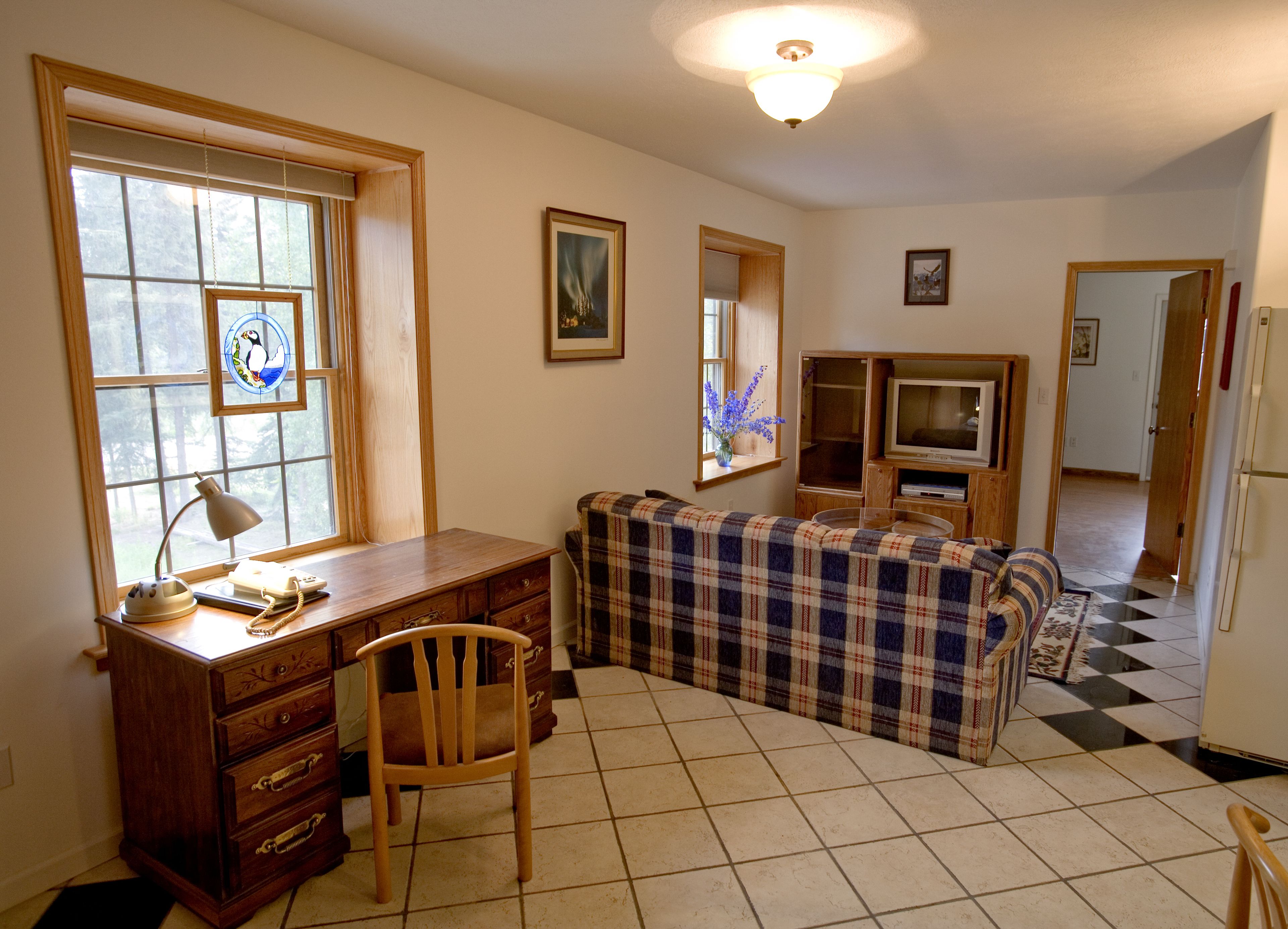 superior suite, 1 king bed, jetted tub | living area | 48-inch led tv with cable channels, tv, dvd player