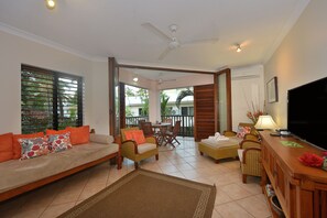 Living area - Seascape Holidays- Hibiscus Apartment (Port Douglas)