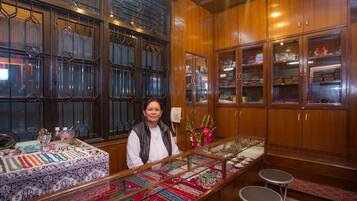 A jewelry store with wooden cabinets and a display counter.