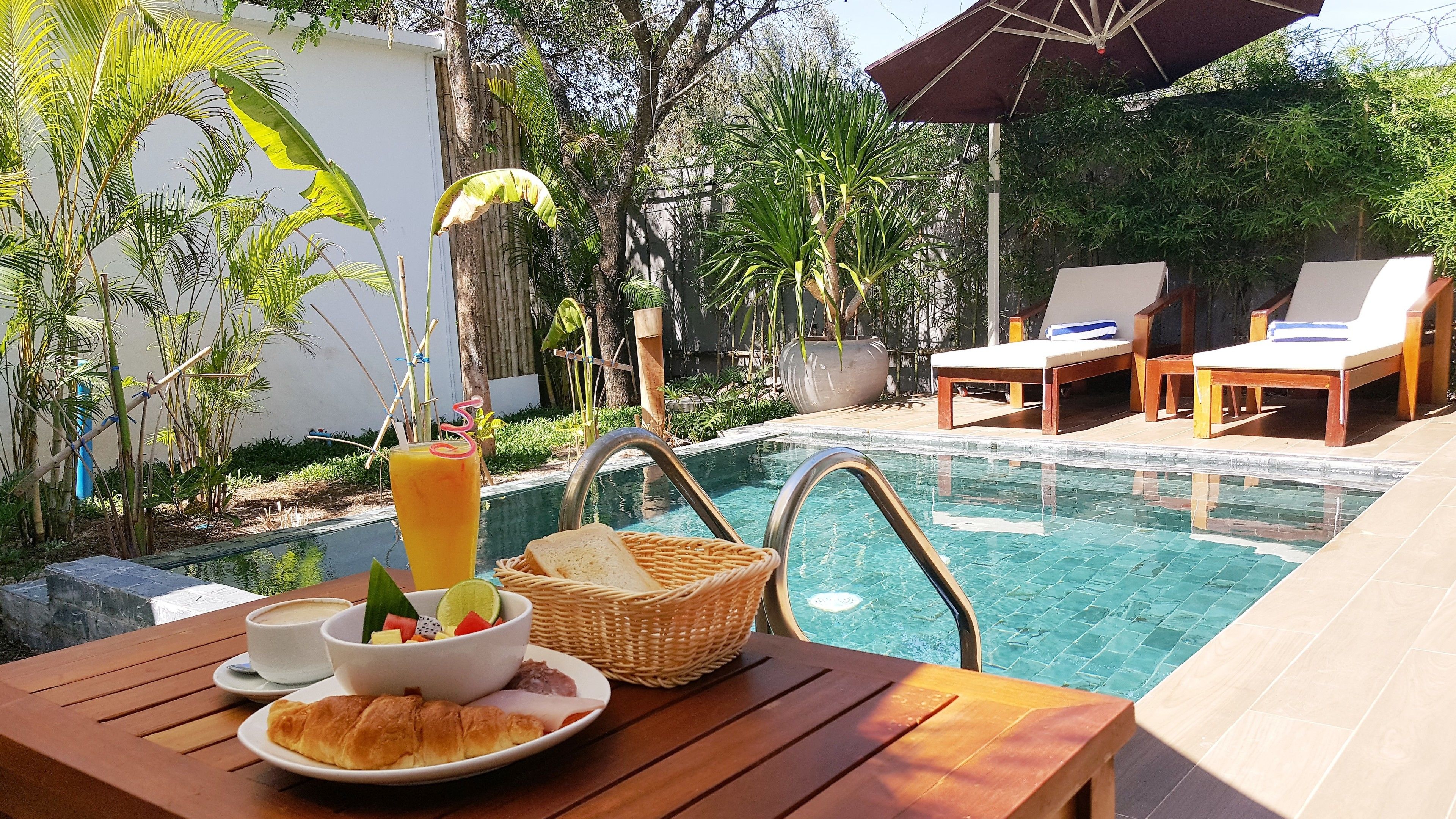 outdoor pool, pool umbrellas, pool loungers