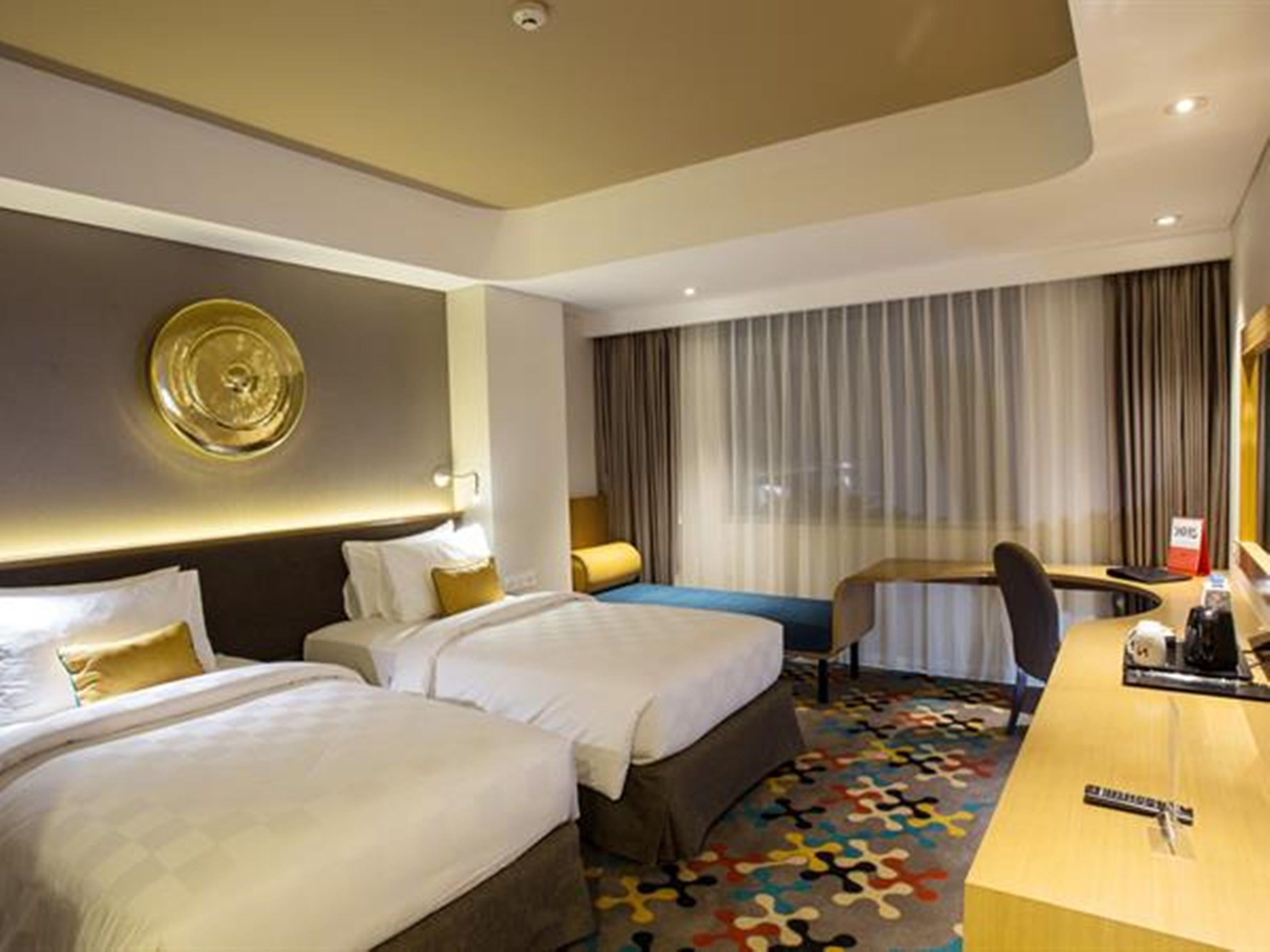 deluxe twin room | in-room safe, desk, laptop workspace, blackout curtains