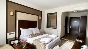 Premium bedding, down comforters, minibar, in-room safe