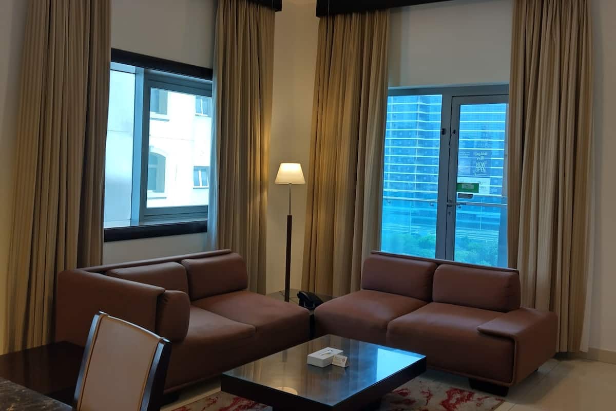 Apartment, 1 Bedroom | Living area | 32-inch TV with cable channels
