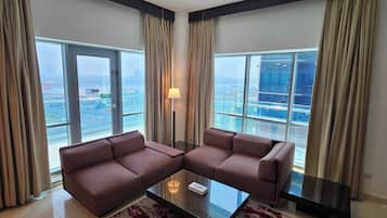 Apartment 1 Bedroom, Creek View | Living area | 32-inch TV with cable channels