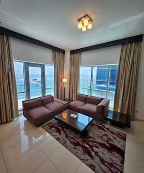 Apartment 1 Bedroom, Creek View | Living area | 32-inch TV with cable channels - Tulip Creek Hotel Apartments (Dubai)