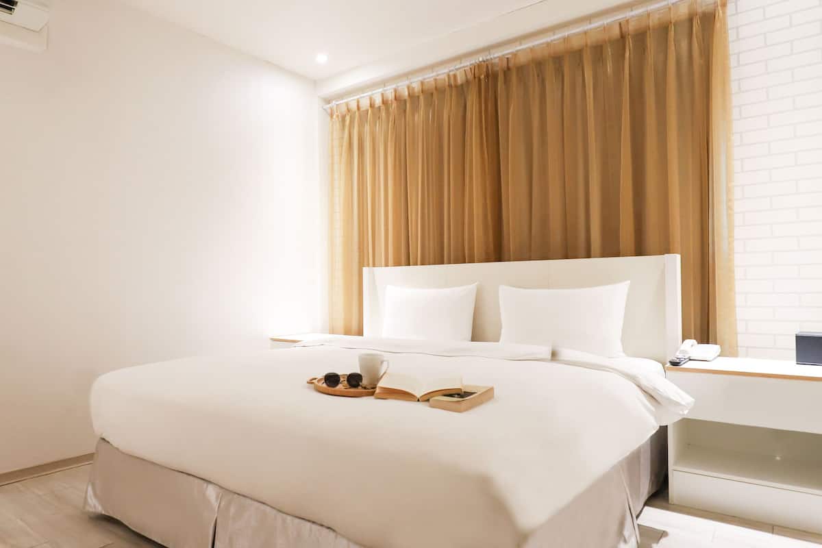 deluxe quadruple room with bathtub | premium bedding, down duvets, in-room safe, individually decorated