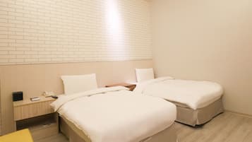 Habitación estándar con 2 camas individuales | Ropa de cama de alta calidad y edredón