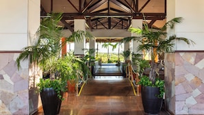 A spacious lobby with a tiled floor, large potted plants, and a view of the outdoors. - Sauipe Terra Resorts - All Inclusive (Mata de São João)