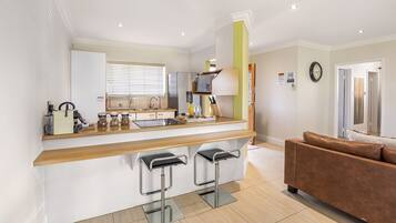 Executive Cottage | Private kitchen | Full-size fridge, microwave, stovetop, espresso maker