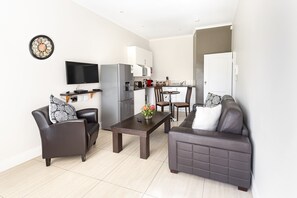 Executive Apartment, 1 Bedroom, Kitchenette, Garden View | Living area | 32-inch flat-screen TV with cable channels, TV - The Haystack on Homestead (Sandton)