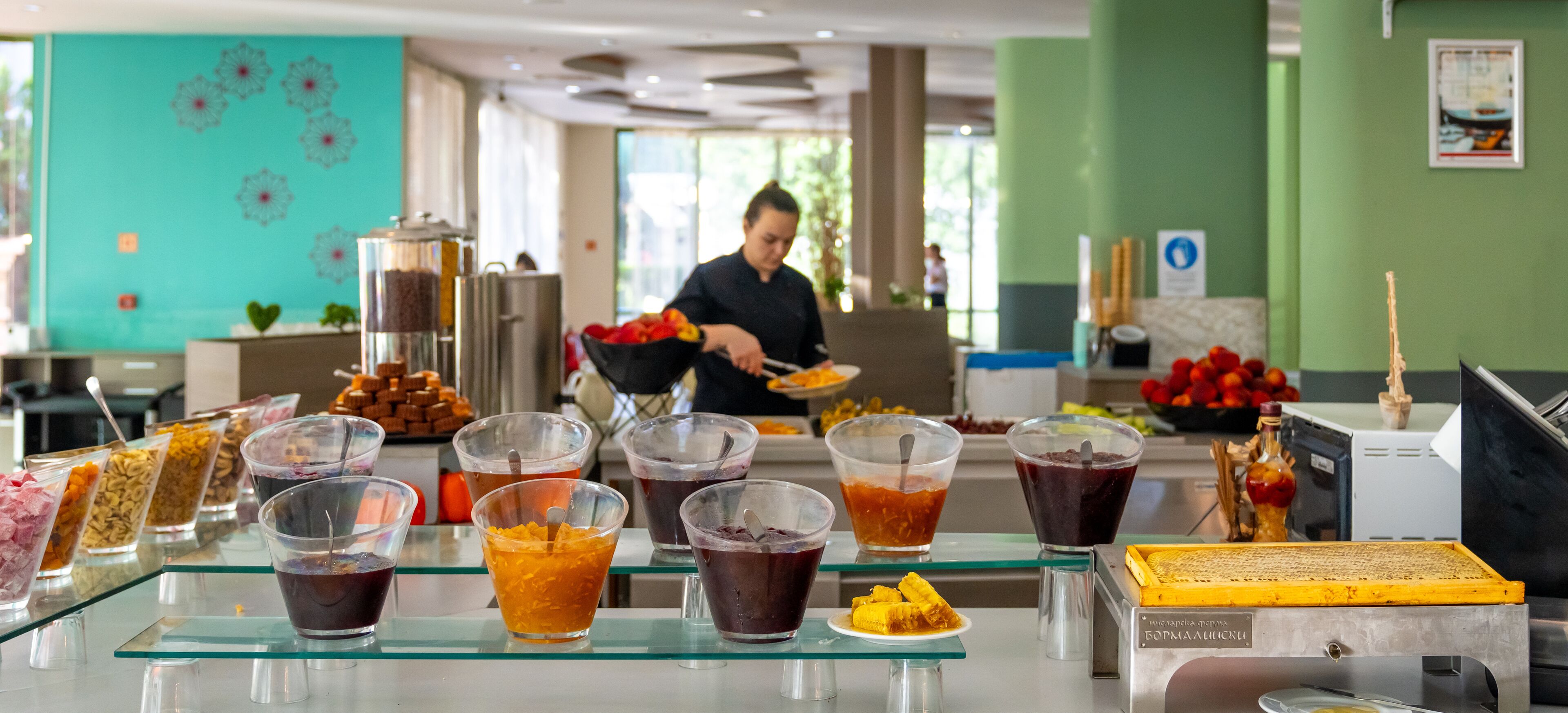 A buffet with various food items and beverages.