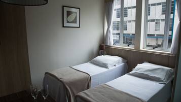 Basic Twin Room | 1 bedroom, Egyptian cotton sheets, down duvets, Select Comfort beds