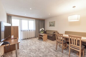 Apartment, 1 Bedroom, Balcony, Mountain View (Typ A) | Living area | 40-inch flat-screen TV with digital channels, TV, pay movies