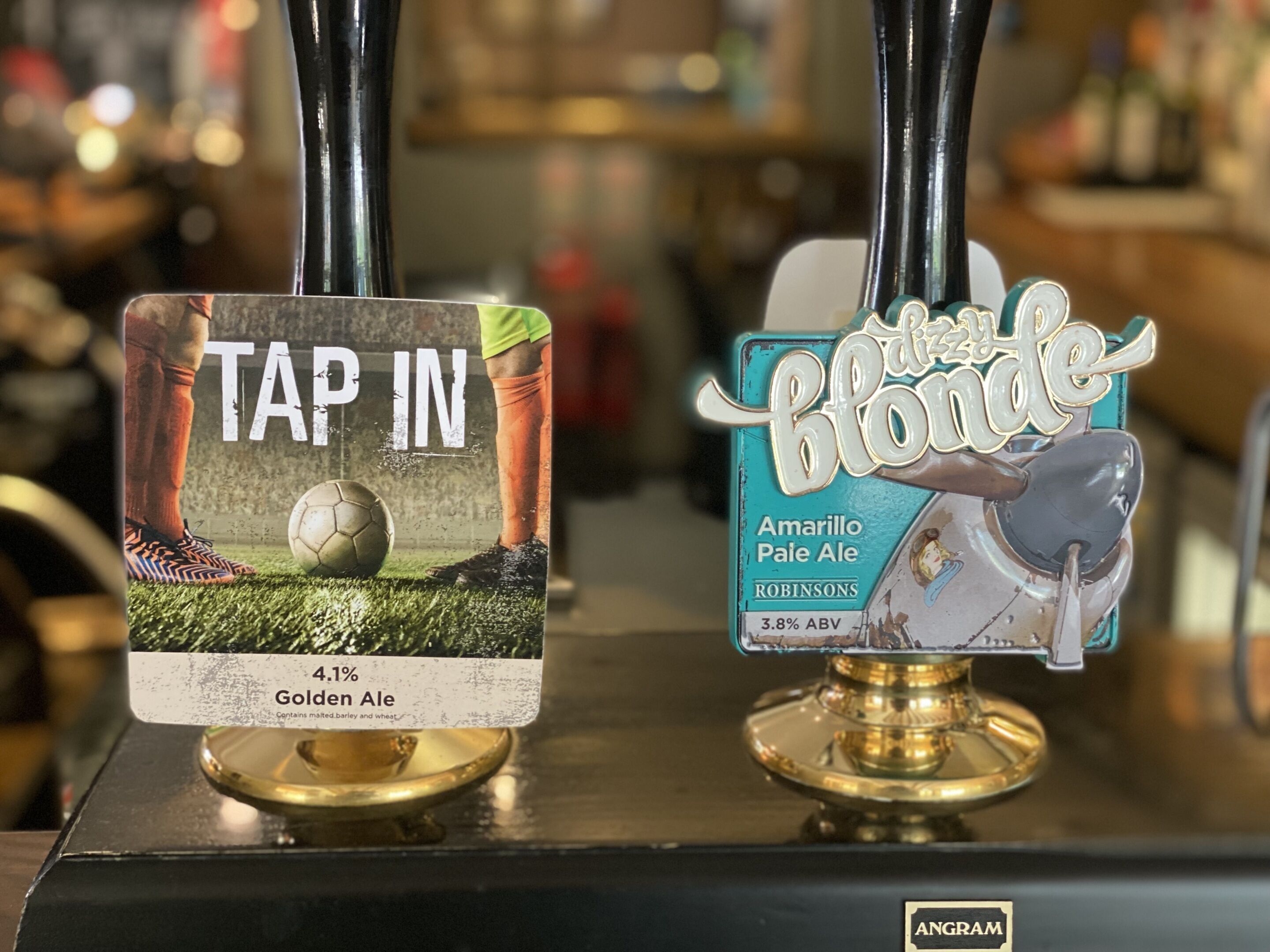 Two beer taps labeled 'Tap In' and 'The Blonde' with their respective beer names and ABV percentages.