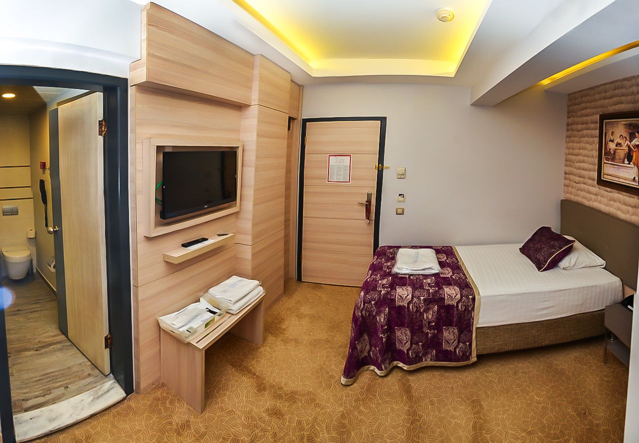 economy single room, 1 bedroom, smoking, courtyard view | premium bedding, minibar, in-room safe, desk