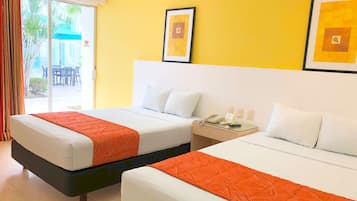 A hotel room with two beds, a glass door leading to an outdoor area, and a yellow wall with framed artwork.