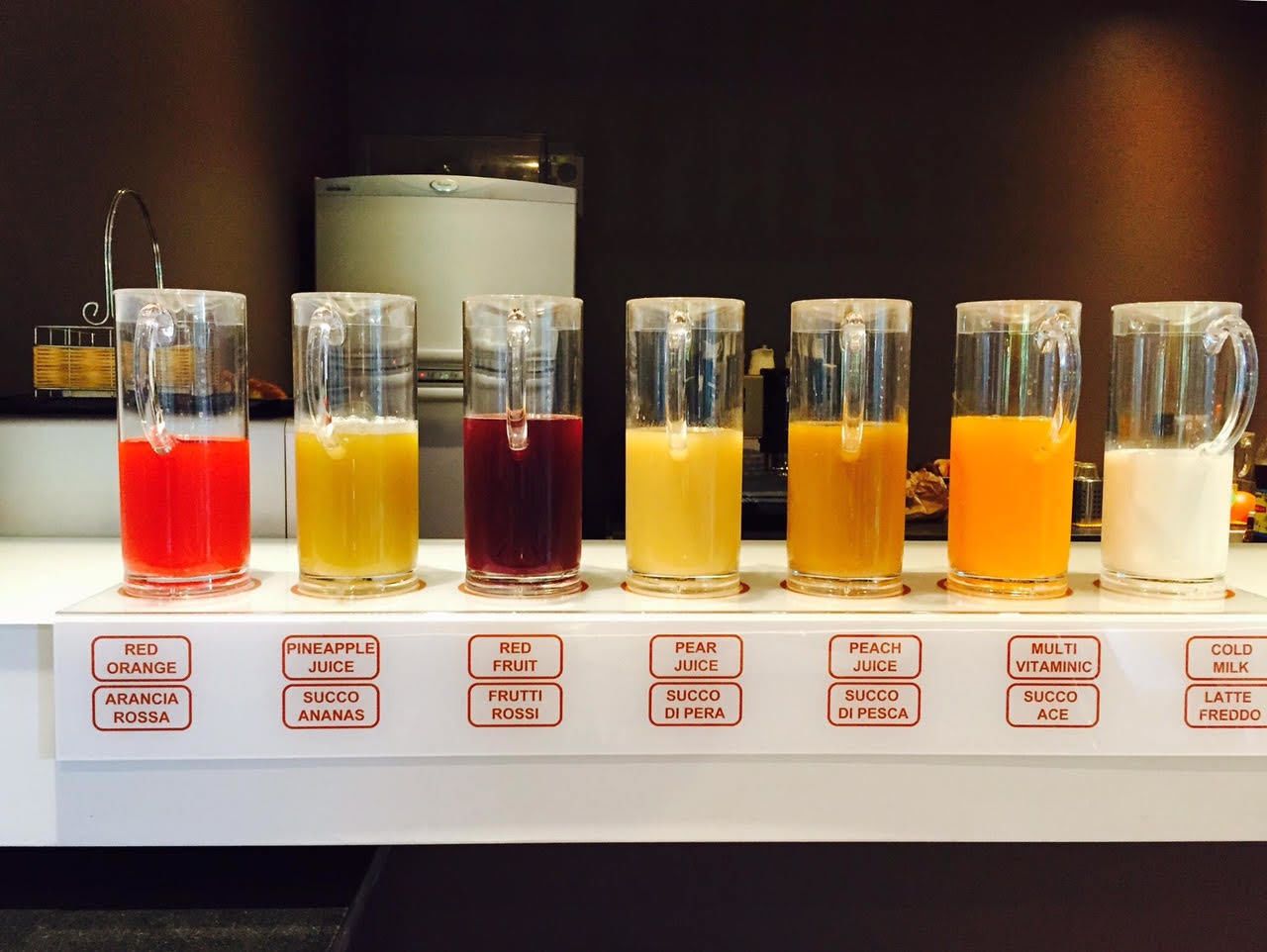 A beverage display with various drinks labeled in Italian.