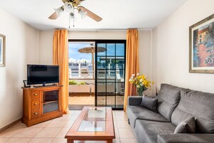 Superior Apartment, 1 Bedroom, Pool View | Living room | 25-inch flat-screen TV with cable channels, TV