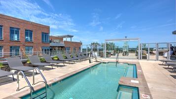 Seasonal outdoor pool, pool loungers