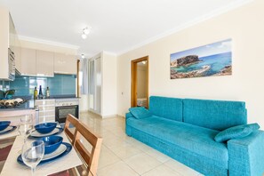 Standard Apartment, 1 Bedroom, Pool View | Living area | 24-inch LED TV with satellite channels, TV