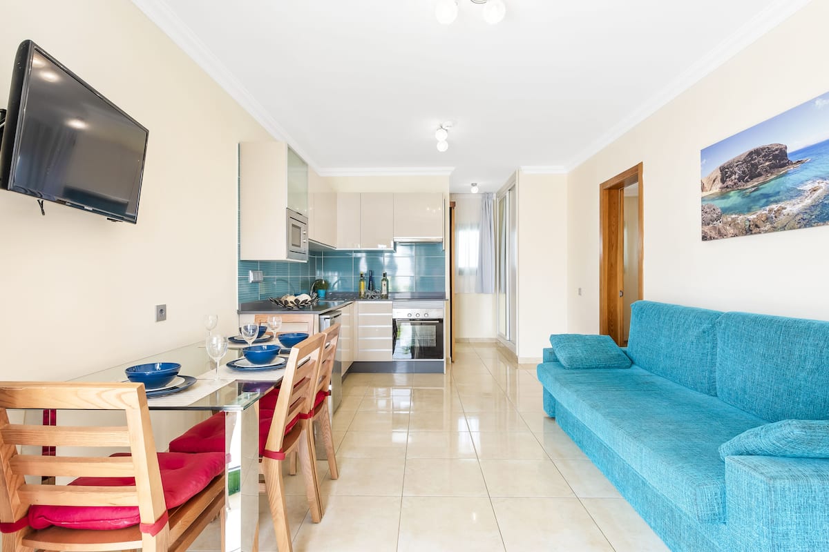 Club Apartment, 1 Bedroom | Living area | 24-inch LED TV with satellite channels, TV