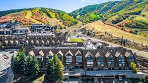 A large building with a symmetrical facade, multiple windows, and a central courtyard. - Lodge at Mountain Village by Park City Vacations (Park City)