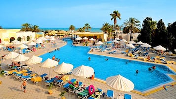 Indoor pool, outdoor pool, pool umbrellas, sun loungers