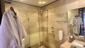 Shower, designer toiletries, hair dryer, bathrobes