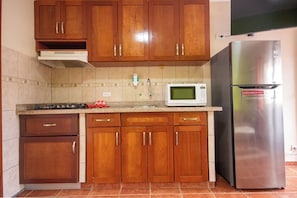 Comfort Room, 1 Bedroom | Private kitchen | Full-sized fridge, microwave, stovetop, coffee/tea maker