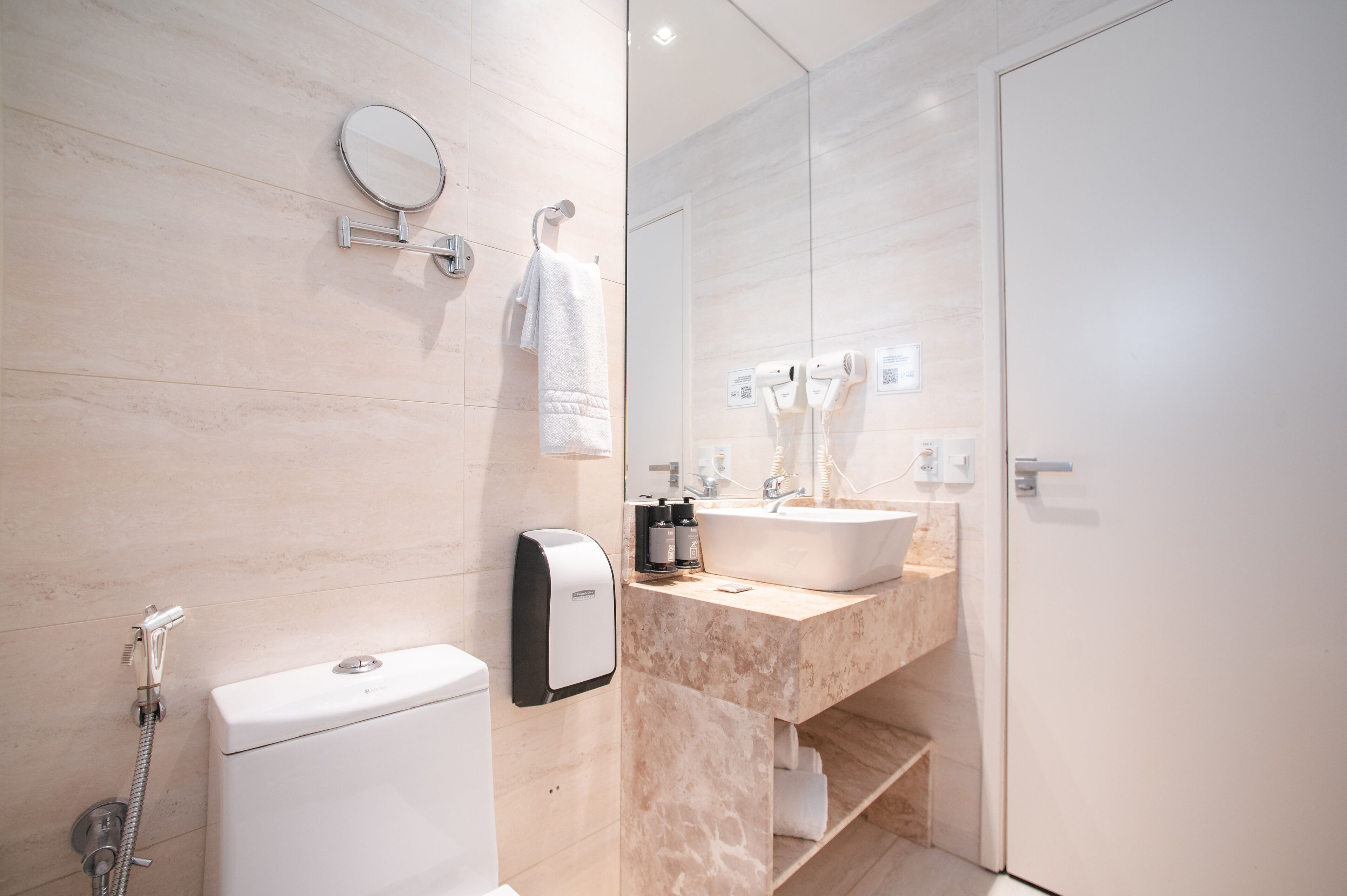 shower, hair dryer, bidet, towels